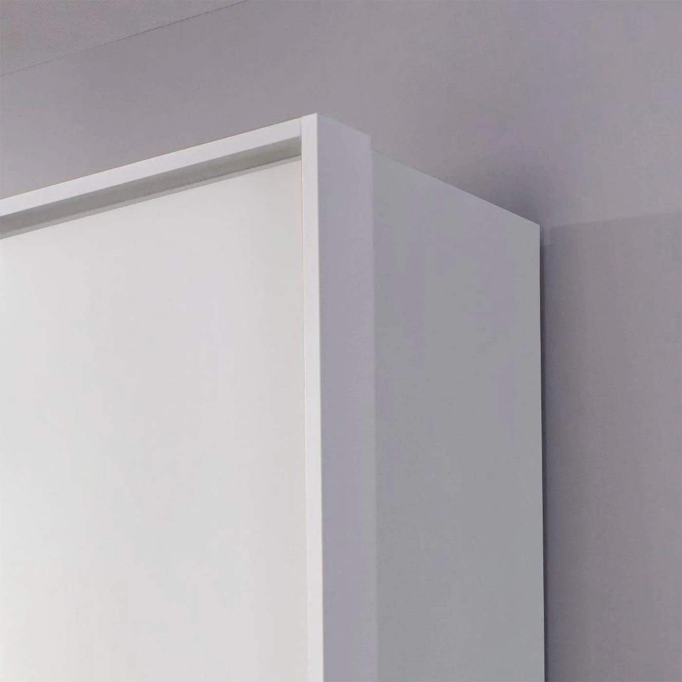 Rauch Leon 4 door mirrored wardrobe with drawers with Passepartout Light Frame close up