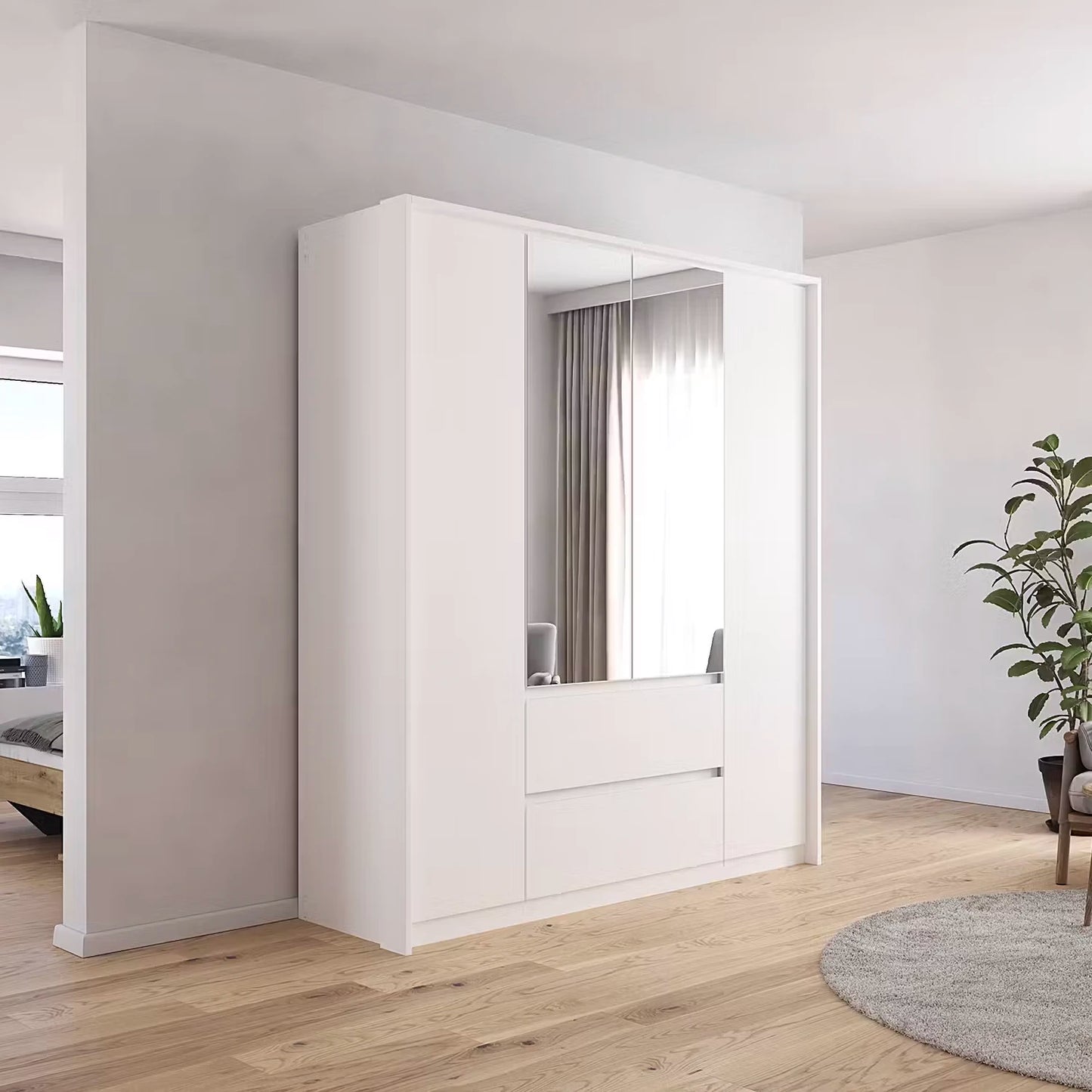 Styled in a room Rauch Leon 4 door mirrored wardrobe with drawers with Passepartout Frame