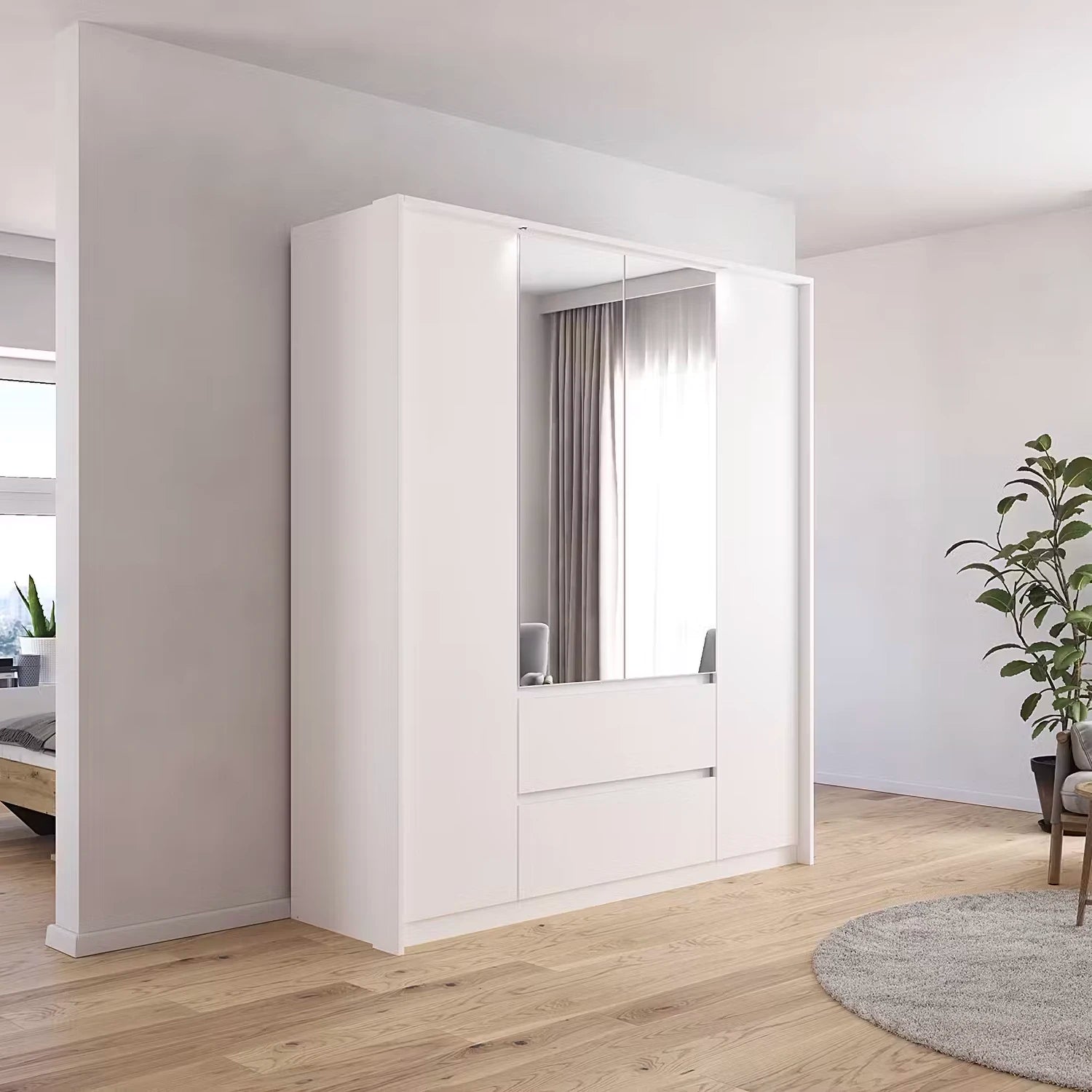 Rauch Leon 4 door mirrored wardrobe with drawers with Passepartout Light Frame - Styled in a room