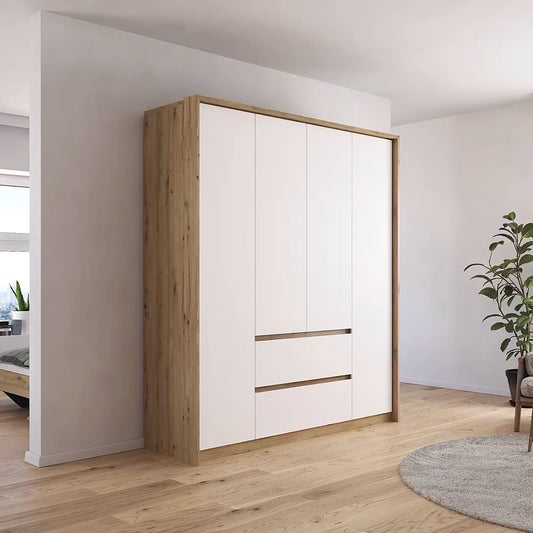 Rauch Mainz Leon Wooden wardrobe with white doors in a room with light wood flooring and a plant.