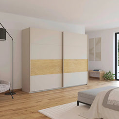 Modern bedroom with a large wardrobe, chair, and bed.