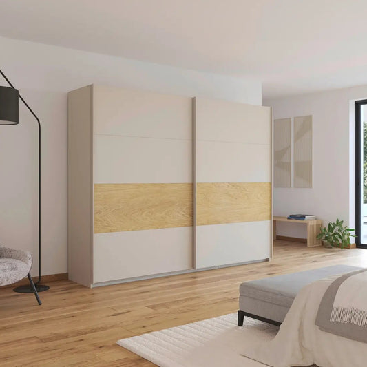 Modern bedroom with a large wardrobe, chair, and bed.