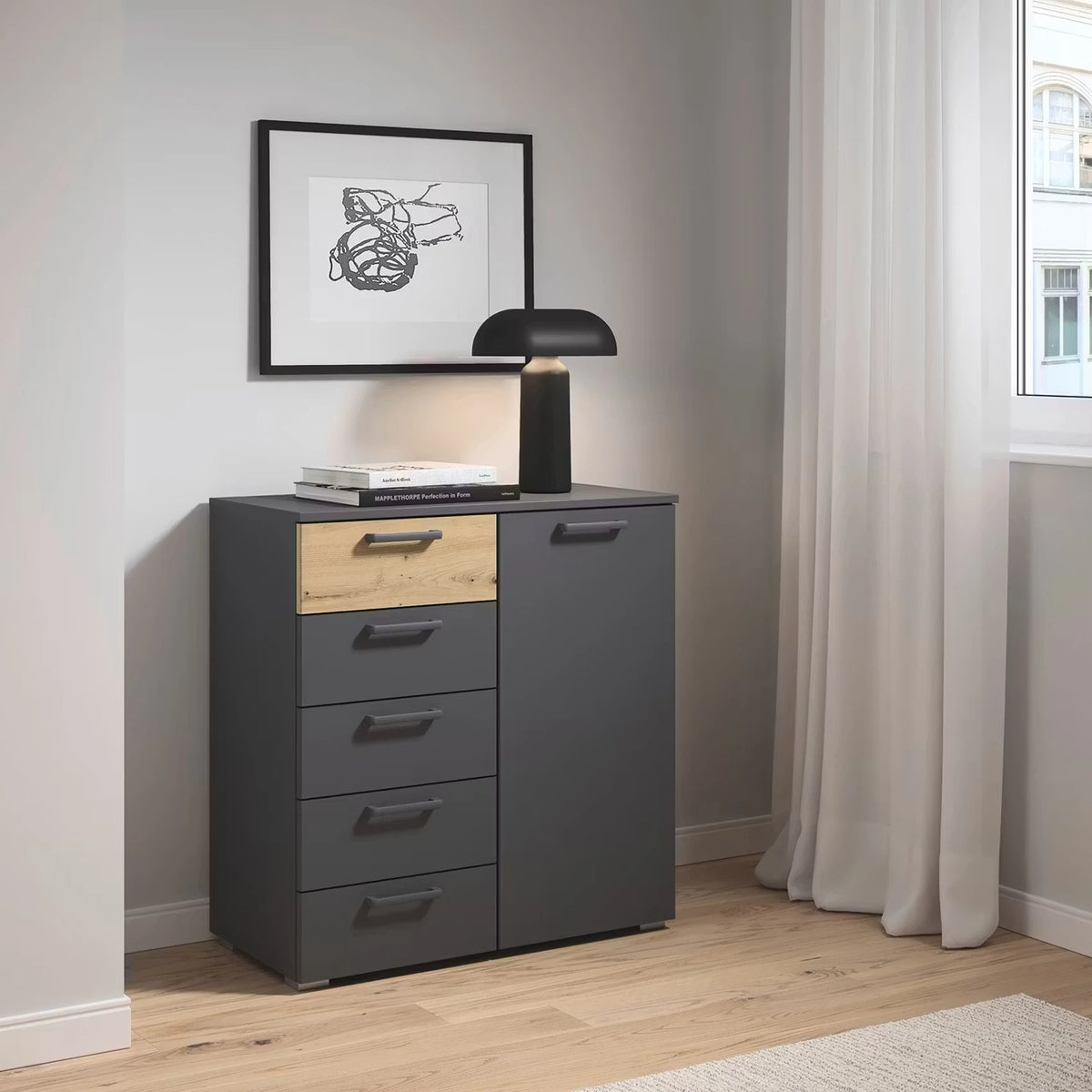 Rauch Miro 1 Door 5 Drawers Bedside Table in Metallic Grey & Artisan Oak styled in a modern bedroom