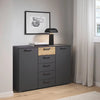 Rauch Miro 2 Door 5 Drawers Bedside Table in Metallic Grey & Artisan Oak styled in a modern bedroom