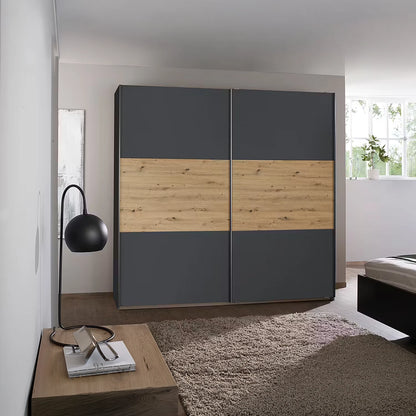 Rauch Miro 2 Door Sliding Wardrobe in Metallic Grey & Artisan Oak styled in a modern bedroom
