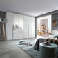 Rauch Montclar White High Gloss 6 Door Wardrobe with Drawers & Mirror - Styled in a Bedroom