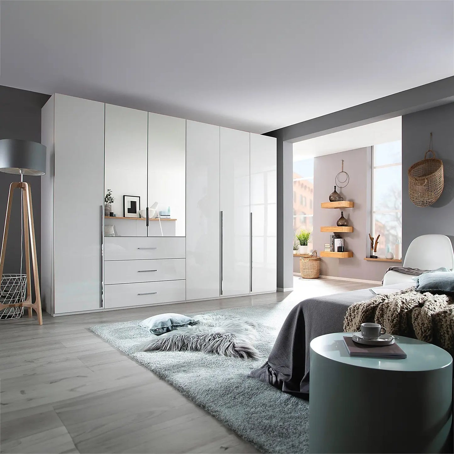 Rauch Montclar White High Gloss 6 Door Wardrobe with Drawers & Mirror - Styled in a Bedroom