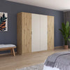 Rauch Monza 4 Door Hinged Door Wardrobe in Artisan Oak & Champagne styled in a modern bedroom