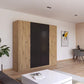 Rauch Monza 4 Door Hinged Door Wardrobe in Artisan Oak & Metallic Grey with mirror styled in a modern bedroom