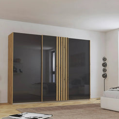 Rauch Mosbach Basalt Glass Large 3 Door Sliding Wardrobe -271 - Styled in a Bedroom