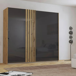 Rauch Mosbach Basalt Glass Sliding Door Wardrobe - W226cm - Styled in a Bedroom