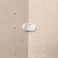 Close-up of a plastic bracket on a wardrobe backing