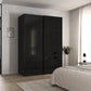 A tall black high-gloss wardrobe Rauch Orange Plus Contido with two sliding doors in a modern bedroom setting next to a bed with white bedding.