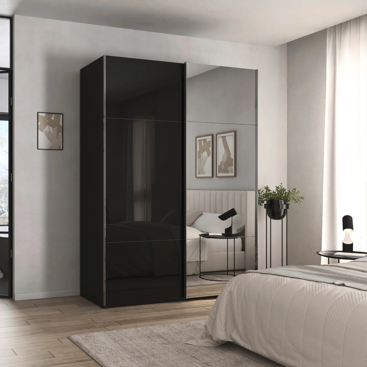 Rauch Orange Plus Contido black glass sliding wardrobe With 1 Mirror door showing the shorter top and bottom panels either side of the tall centre panel Chrome Handles