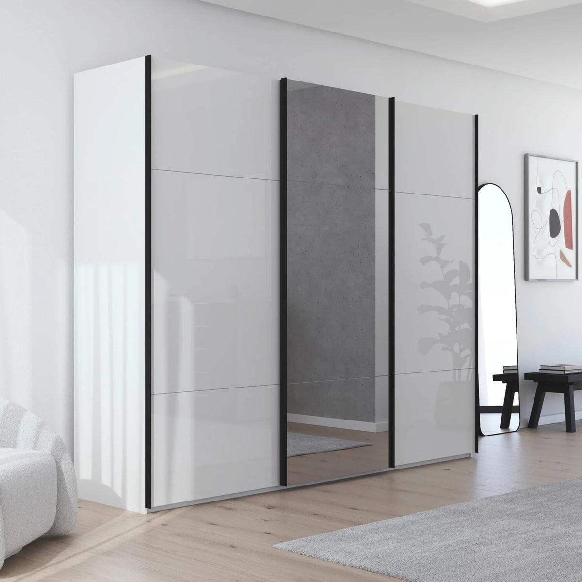 A modern Rauch sliding wardrobe with three doors in glossy glass white, and mirrored finishes, set in a bright, contemporary room with light wood floors and a gray rug.