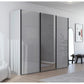 A modern three-panel sliding wardrobe with glossy gray glass doors, Middle Mirror door and slim black Handle bars