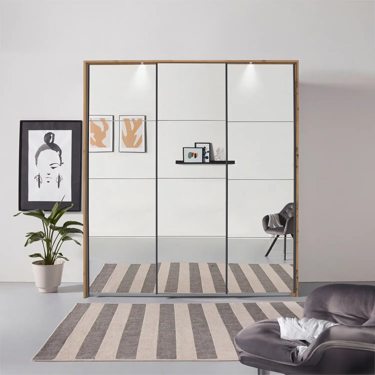 Rauch Prism Artisan Oak 3 Door Full Mirror Sliding Wardrobe - 203cm - Passepartout Frame with Light - Styled in a Bedroom
