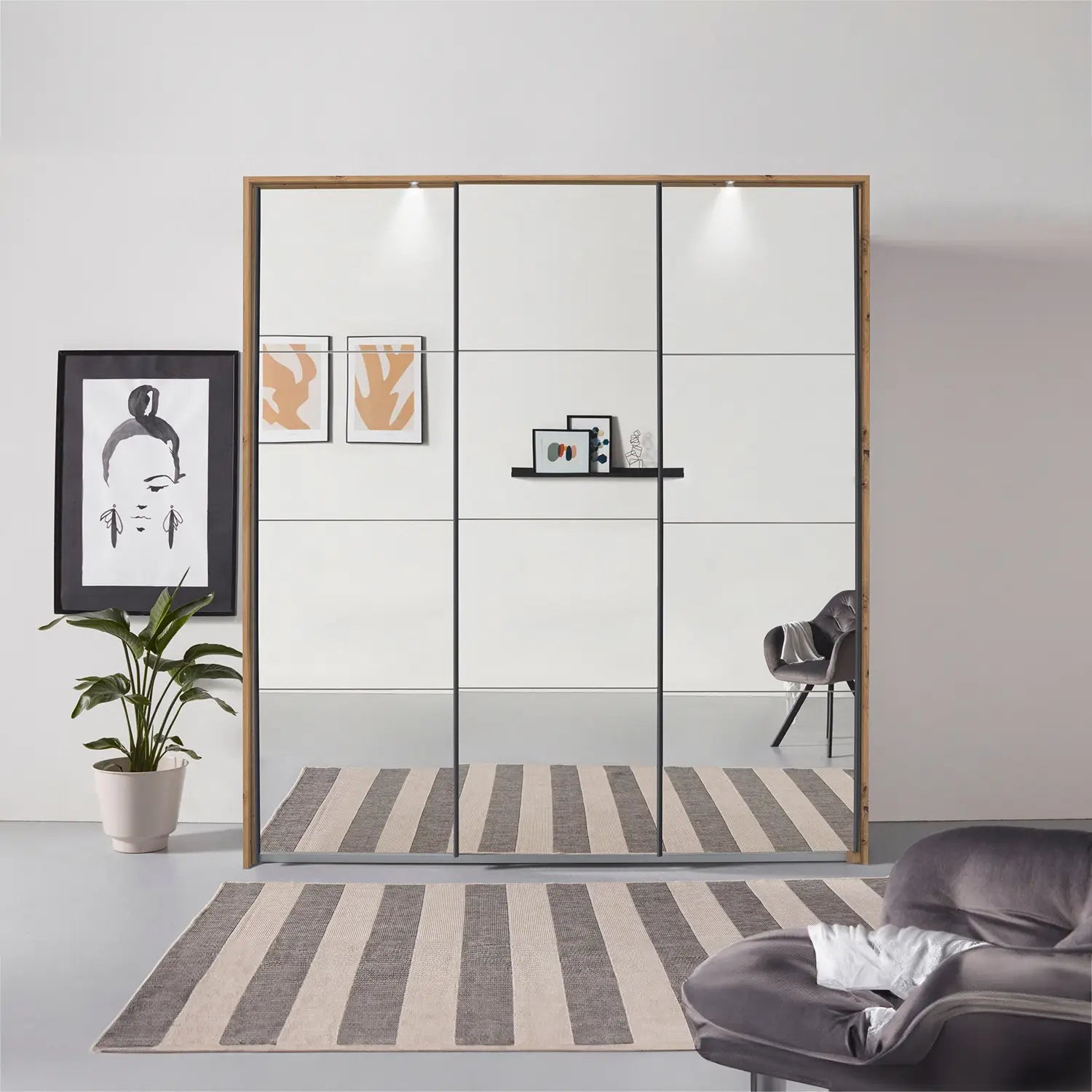 Rauch Prism Artisan Oak 3 Door Full Mirror Sliding Wardrobe - 203cm - Passepartout Frame with Light - Styled in a Bedroom