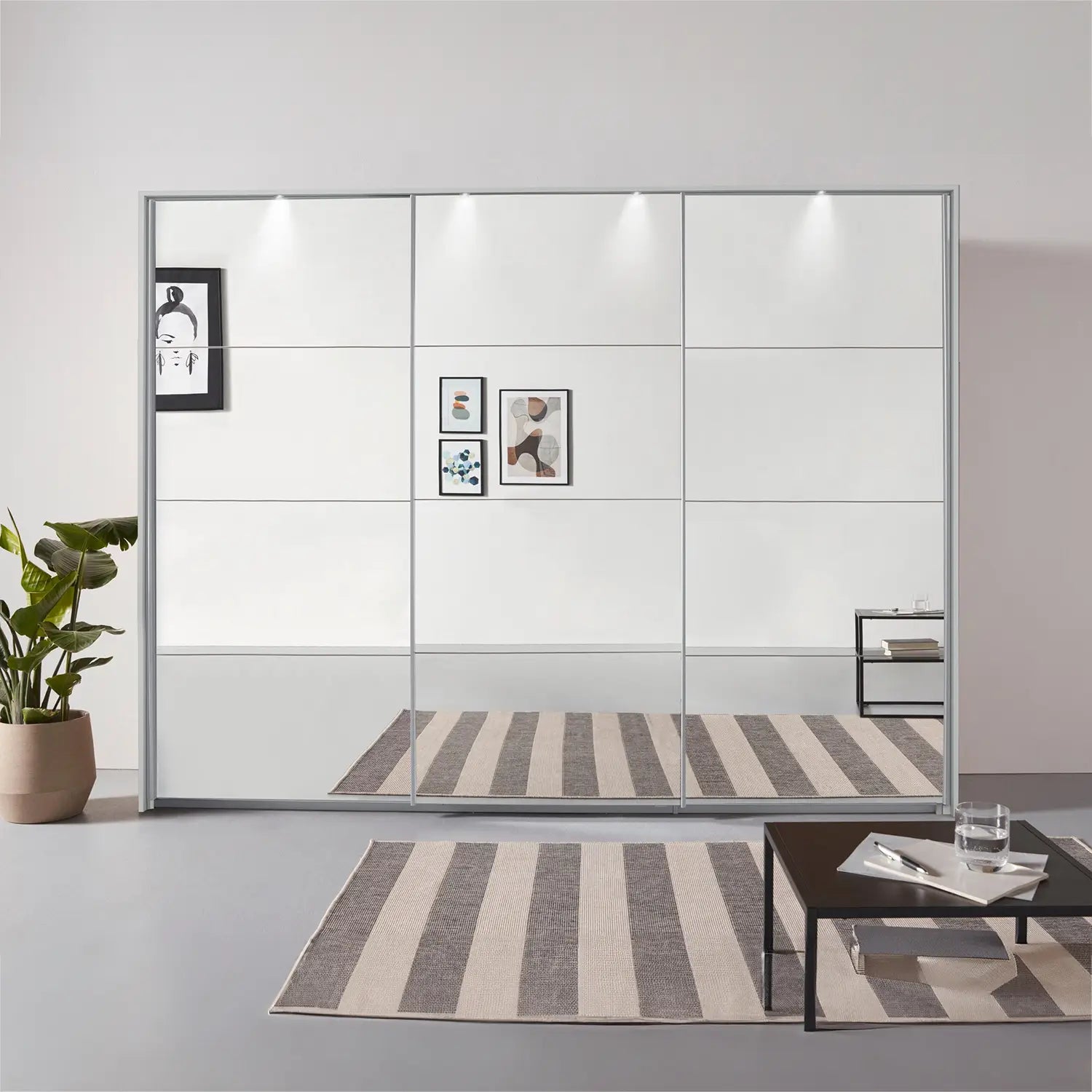 Rauch Prism Silk Grey 3 Door Full Mirror Sliding Wardrobe - 271cm - Passepartout Frame with Light - Styled in a Bedroom