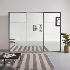 Rauch Prism Metallic Grey 3 Door Full Mirror Sliding Wardrobe - 271cm - Styled in a Bedroom