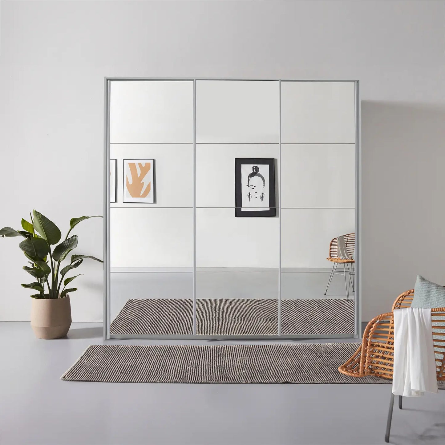 Rauch Prism Silk Grey 3 Door Full Mirror Sliding Wardrobe - 203cm - Passepartout Frame Styled in a Bedroom