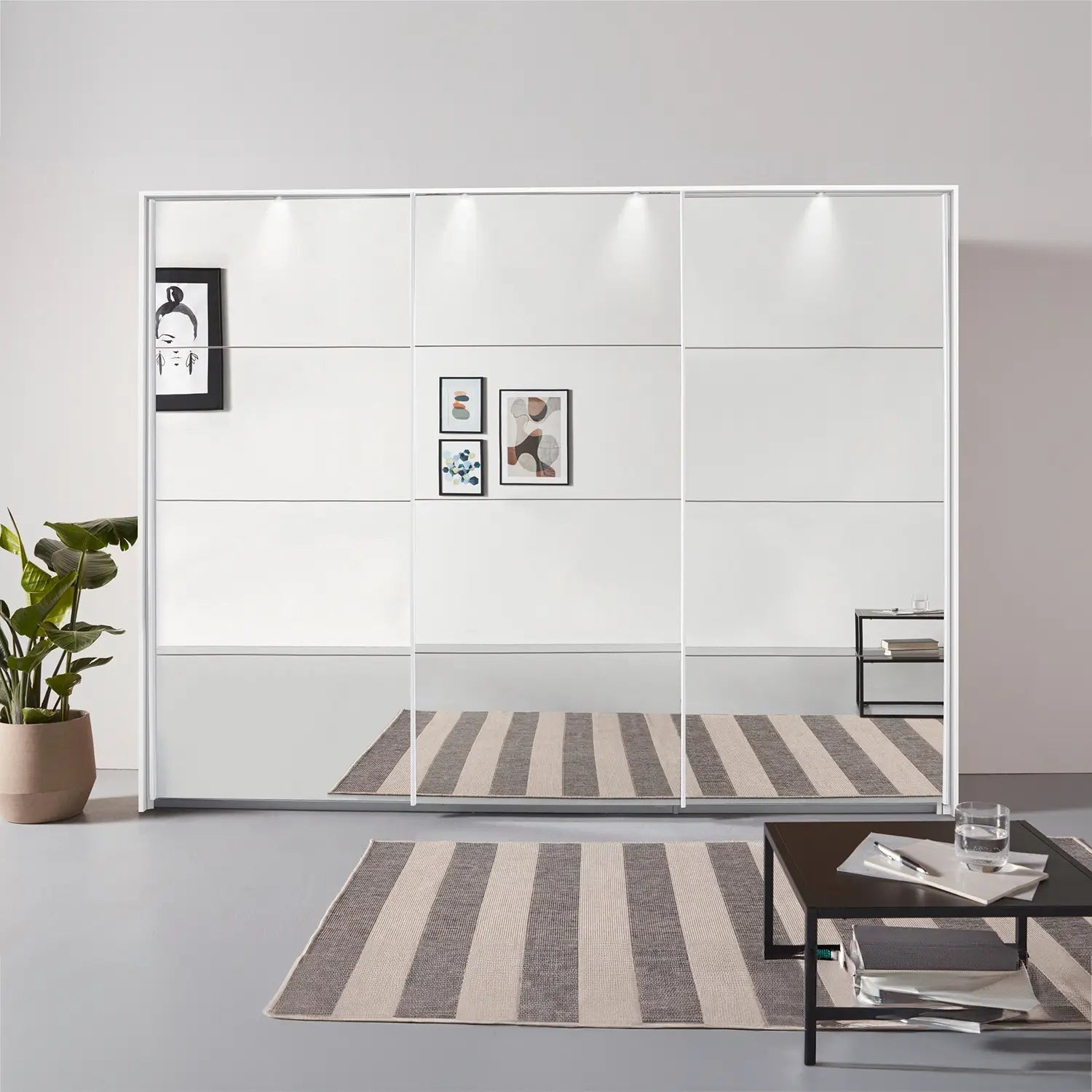 Rauch Prism White 3 Door Full Mirror Sliding Wardrobe - 271cm - Passepartout Frame with Light - Styled in a Bedroom