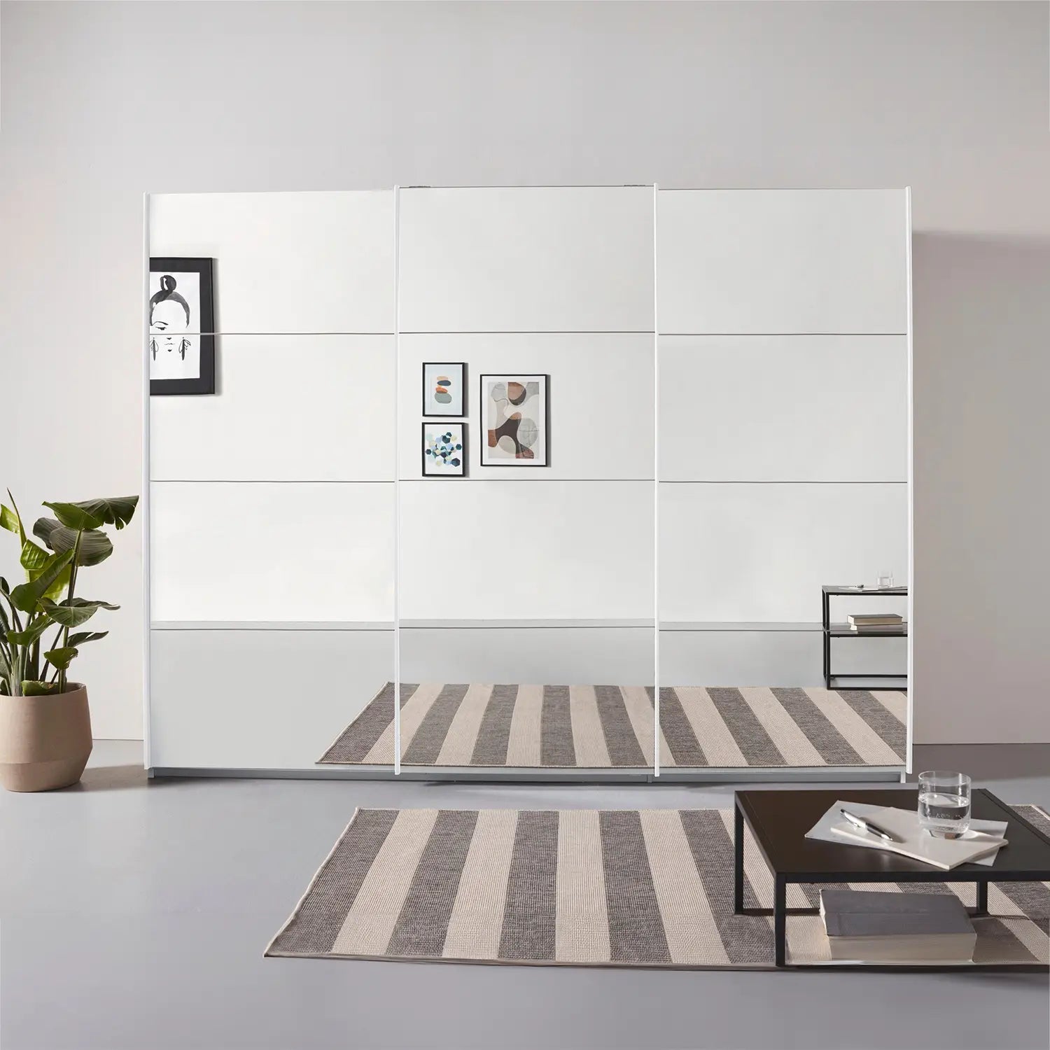 Rauch Prism White 3 Door Full Mirror Sliding Wardrobe - 271cm - Styled in a Bedroom