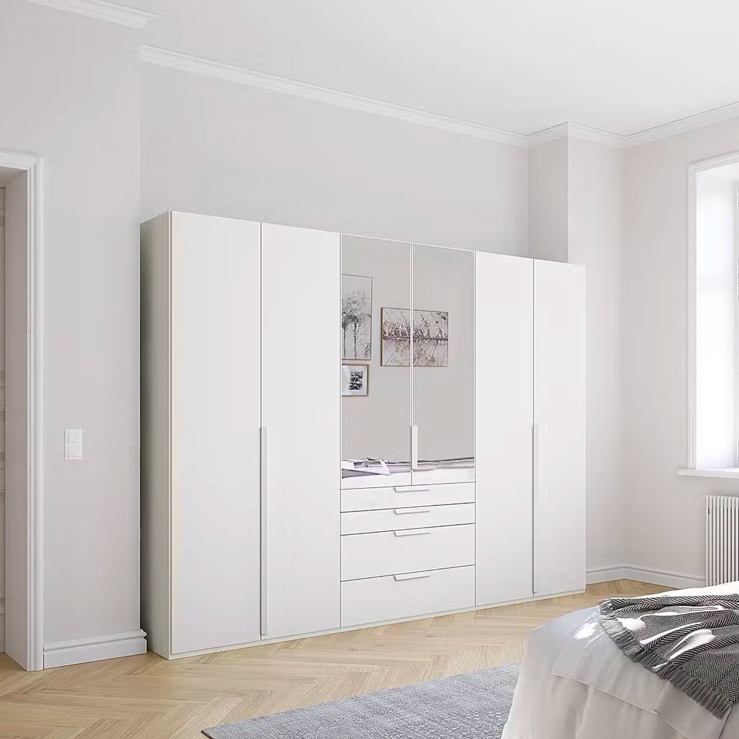 A tall white wardrobe by Rauch with mirrored doors and a central drawer unit, shown in a bright, modern bedroom