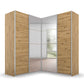 A modern Rauch Lema corner wardrobe with light brown wood grain doors and mirrored sliding panels, shown on a clean white background.