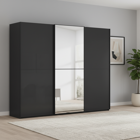A modern Rauch black Supreme Duo sliding wardrobe with three doors and mirrored centre door, shown in a minimalist room setting with a light rug, wall art, and a potted plant.
