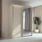 Rauch Taro 2 Door 1 Mirror Door Sliding Wardrobe in Champagne with passepartout light frame finish styled in a modern bedroom