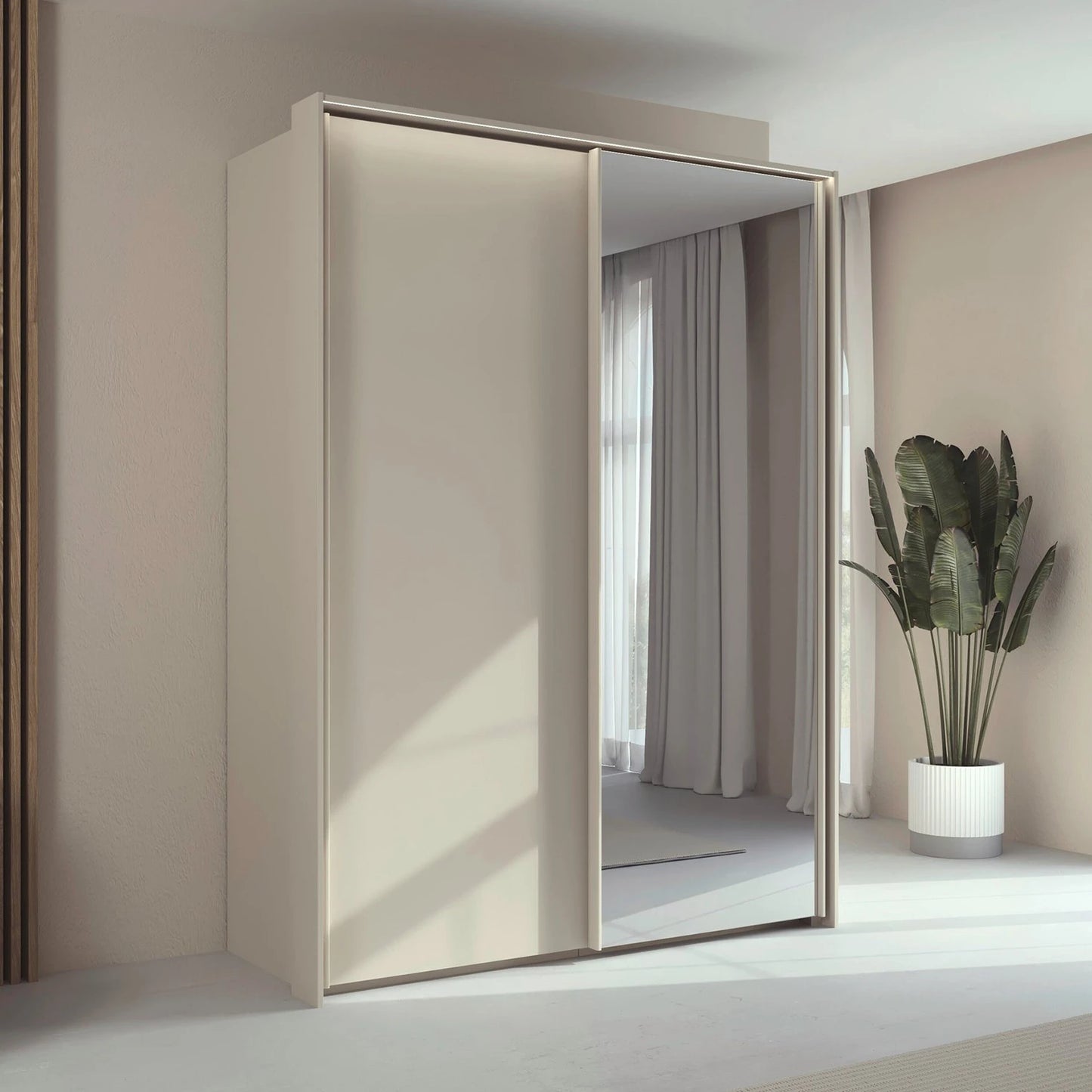 Rauch Taro 2 Door 1 Mirror Door Sliding Wardrobe in Champagne with passepartout light frame finish styled in a modern bedroom