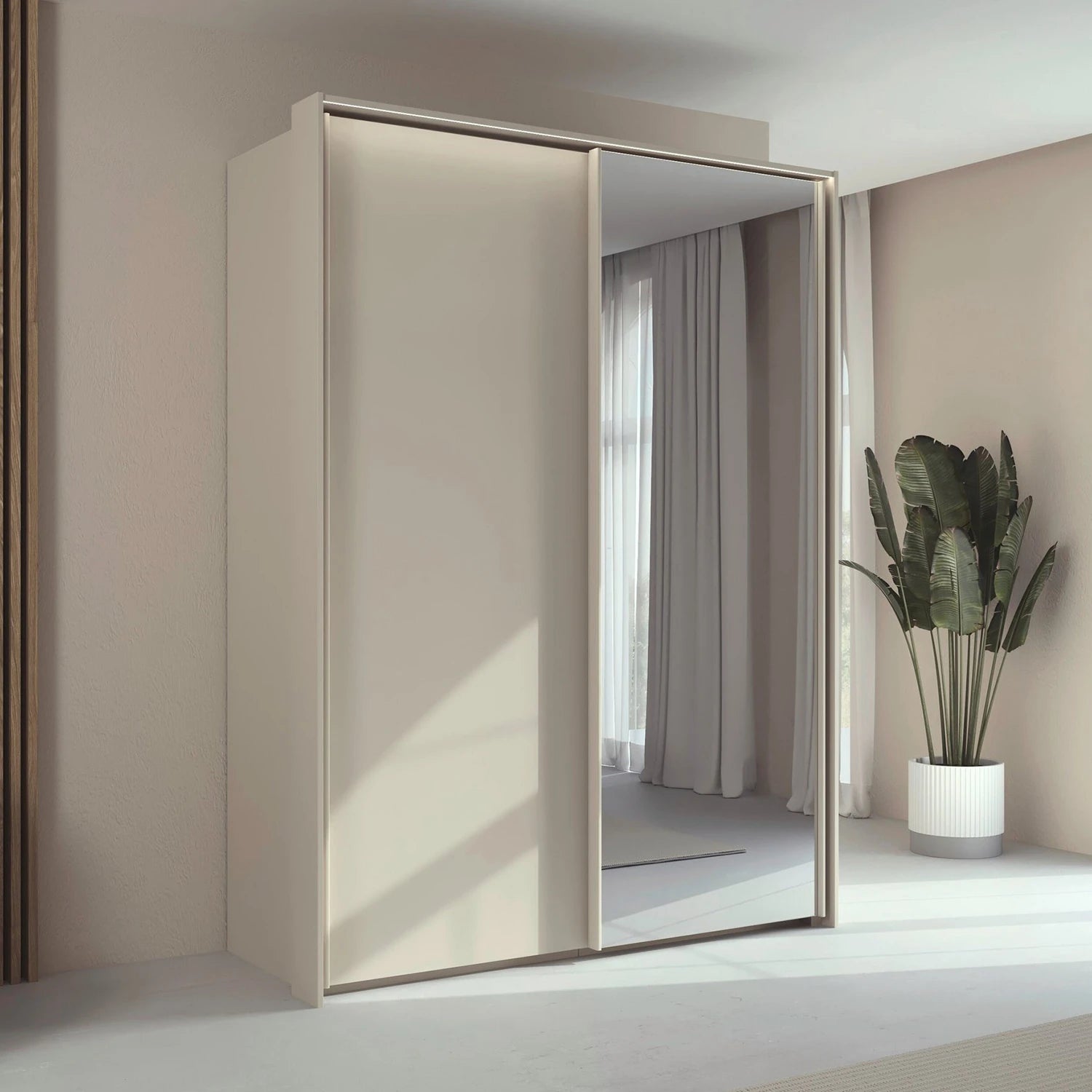 Rauch Taro 2 Door 1 Mirror Door Sliding Wardrobe in Champagne with passepartout light frame finish styled in a modern bedroom