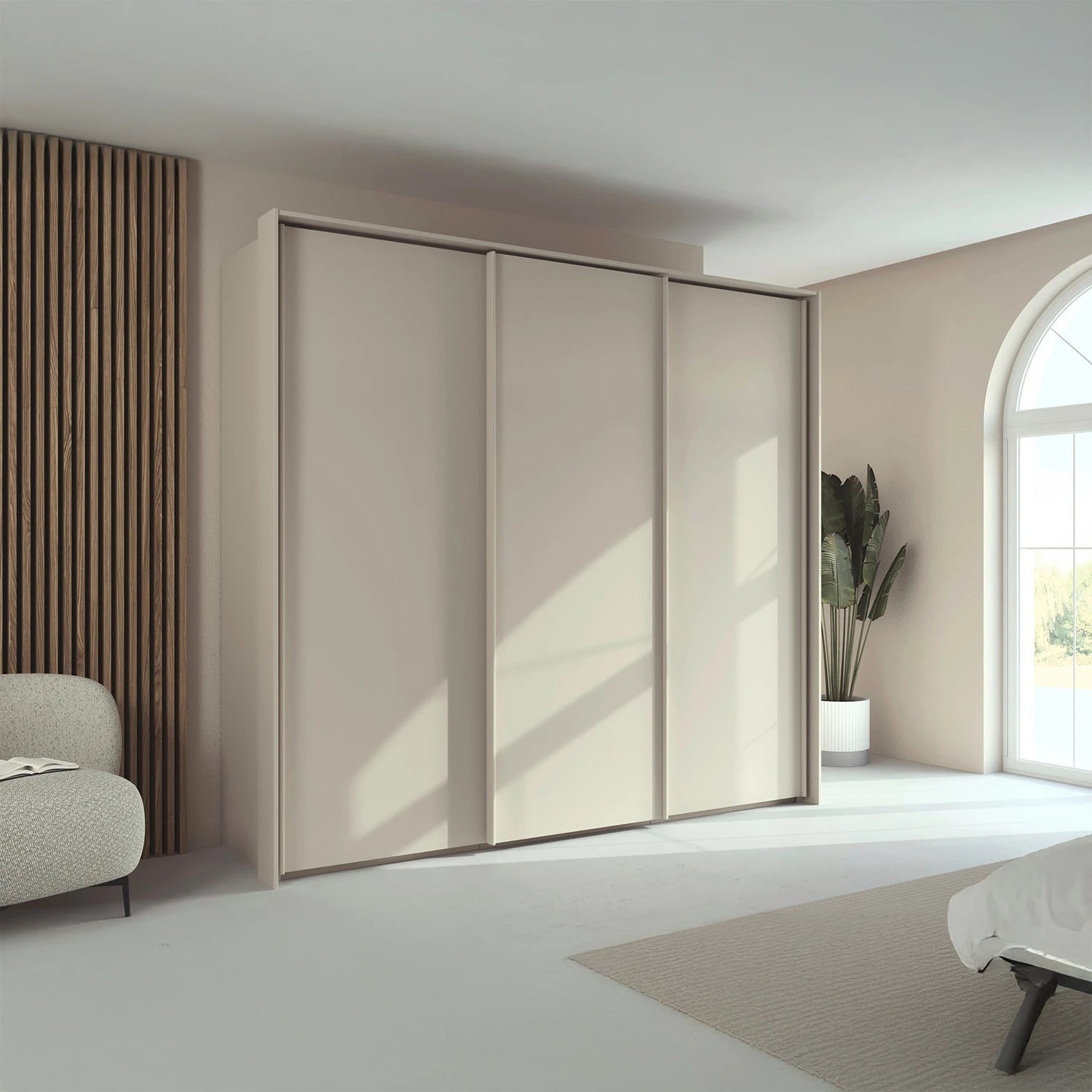 Rauch Taro 3 Door Sliding Wardrobe in Champagne finish with passepartout frame styled in a modern room