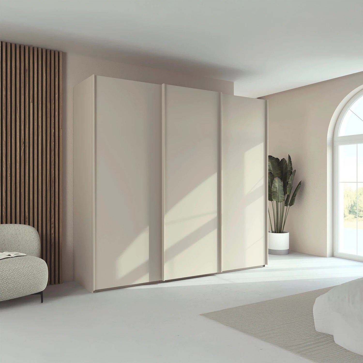 Rauch Taro 3 Door Sliding Wardrobe in Champagne finish styled in a modern bedroom