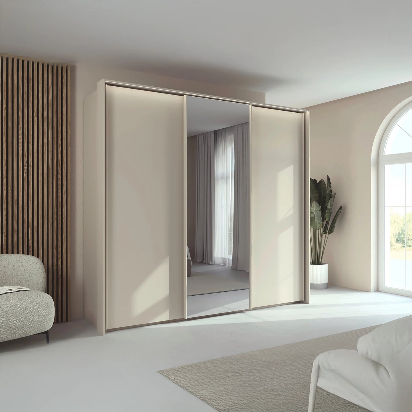 Rauch Tara 3 Door Sliding Wardrobe in Champagne with central mirror door with passepartout light frame styled in a modern bedroom