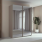 Rauch Taro 2 Door full mirror sliding wardrobe with Fango Carcase double mirrored doors styled in a modern bedroom