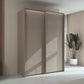 Rauch Taro 2 Door Sliding Wardrobe in Champagne finish with passepartout frame with light styled in a room