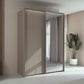 Rauch Taro 2 Door 1 Mirror Door Sliding Wardrobe in Fango finish with passepartout light frame styled in a modern bedroom