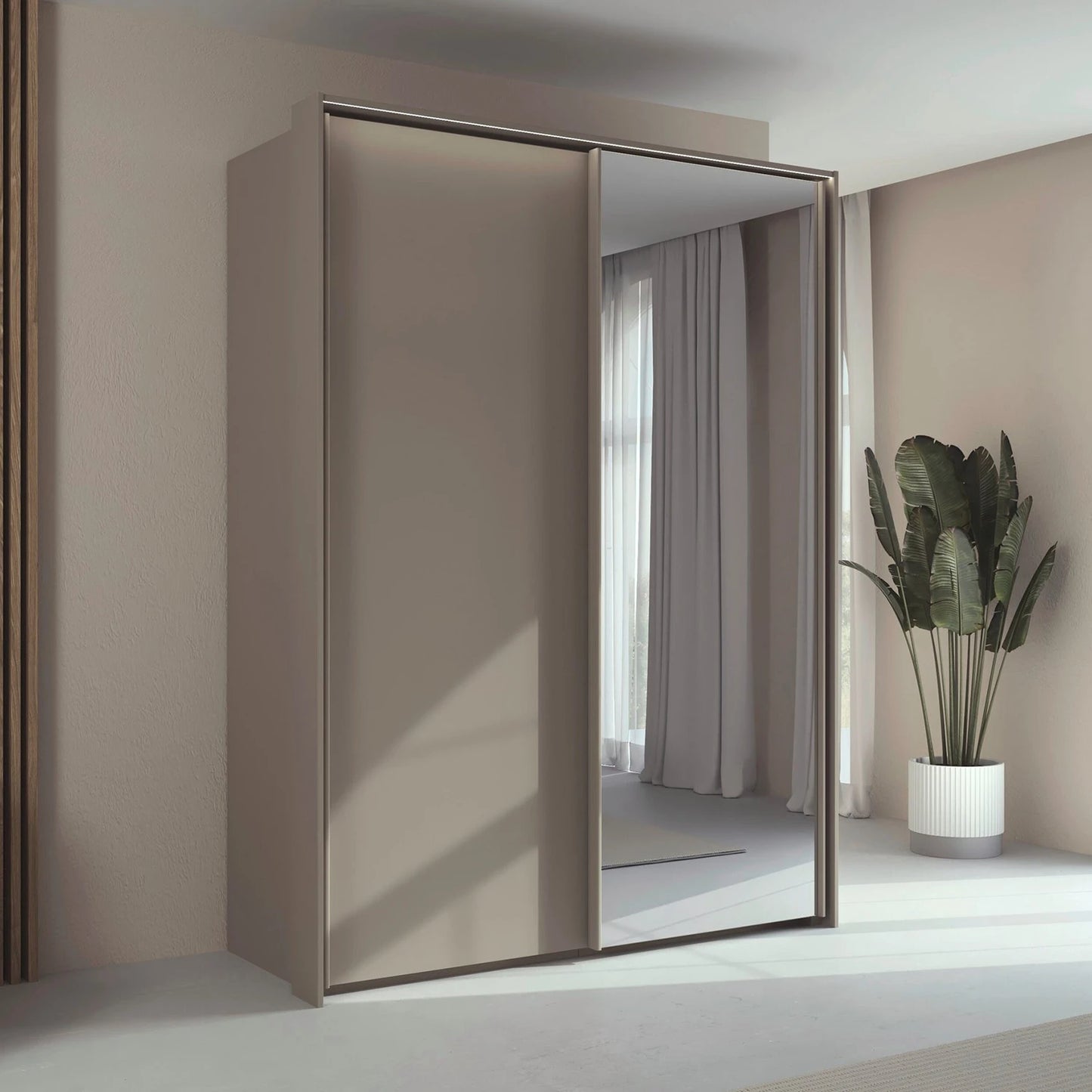 Rauch Taro 2 Door 1 Mirror Door Sliding Wardrobe in Fango finish with passepartout light frame styled in a modern bedroom