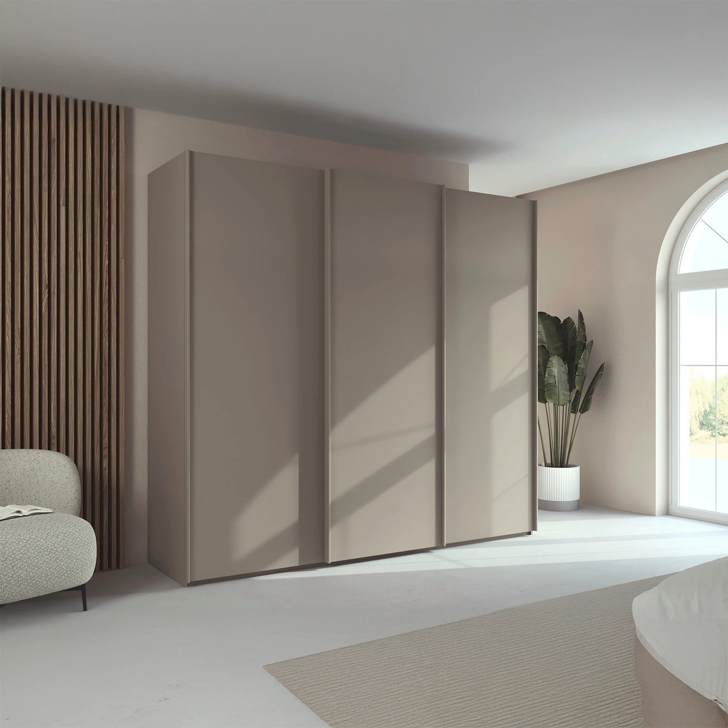 Rauch Taro 3 Door Sliding Wardrobe in Fango finish styled in a modern bedroom