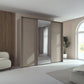 Rauch Tara 3 Door Sliding Wardrobe in Fango with central mirror door with passepartout frame styled in a modern bedroom