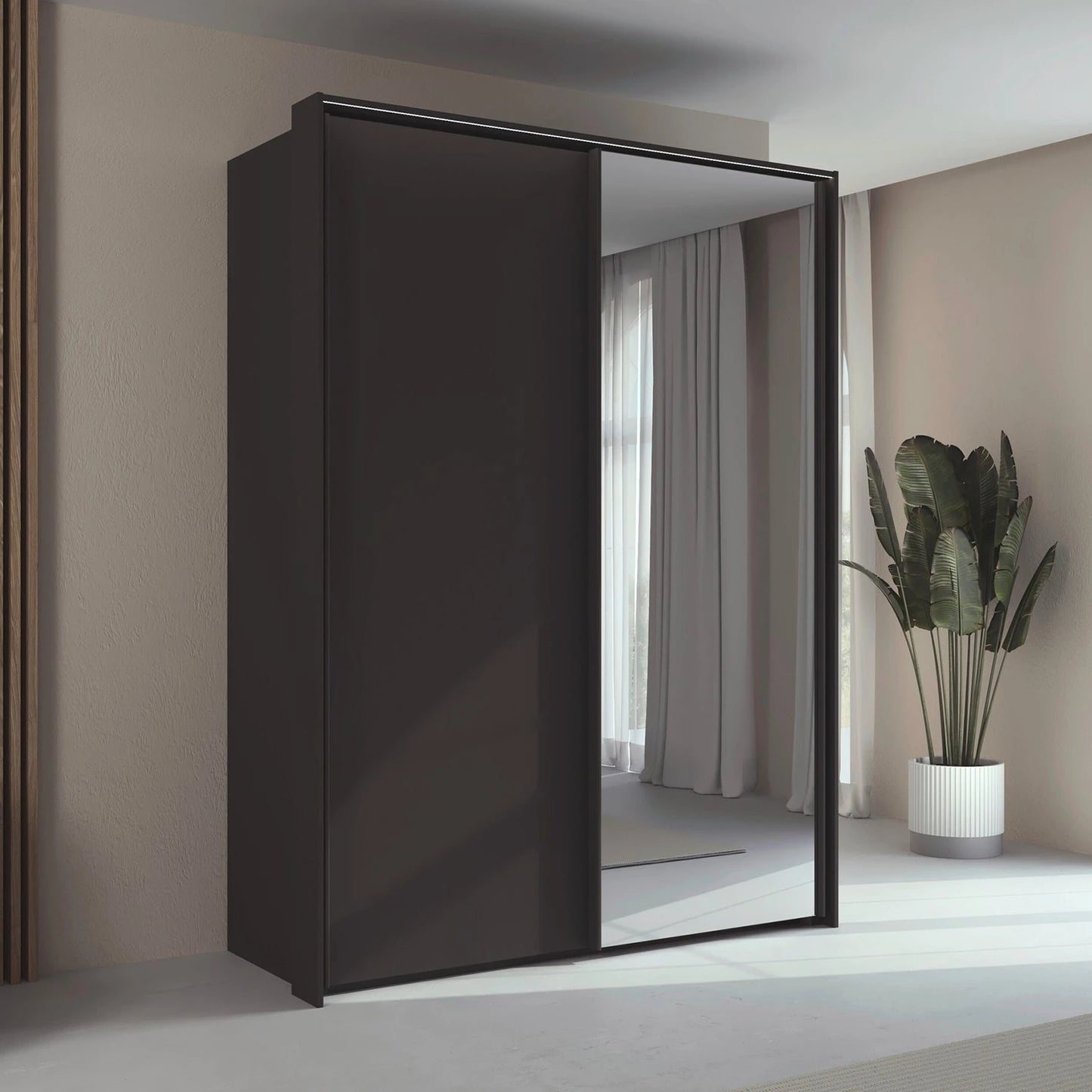 Rauch Taro 2 Door 1 Mirror Door Sliding Wardrobe in Graphite finish with passepartout frame styled in a modern bedroom