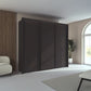 Rauch Taro 3 Door Sliding Wardrobe in Graphite finish styled in a modern bedroom