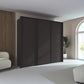 Rauch Taro 3 Door Sliding Wardrobe in Graphite finish with passepartout frame styled in a modern bedroom