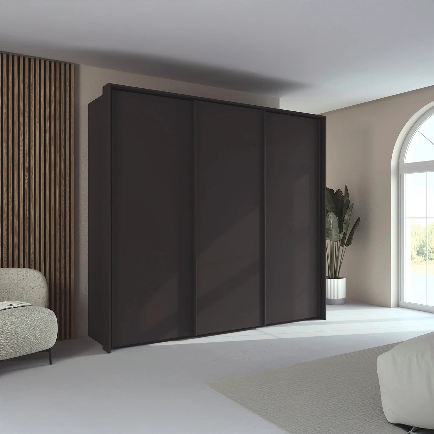 Rauch Taro 3 Door Sliding Wardrobe in Graphite finish with passepartout frame styled in a modern bedroom