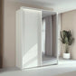 Rauch Taro 2 Door 1 Mirror Door Sliding Wardrobe in Alpine White finish with passepartout light frame styled in a modern bedroom