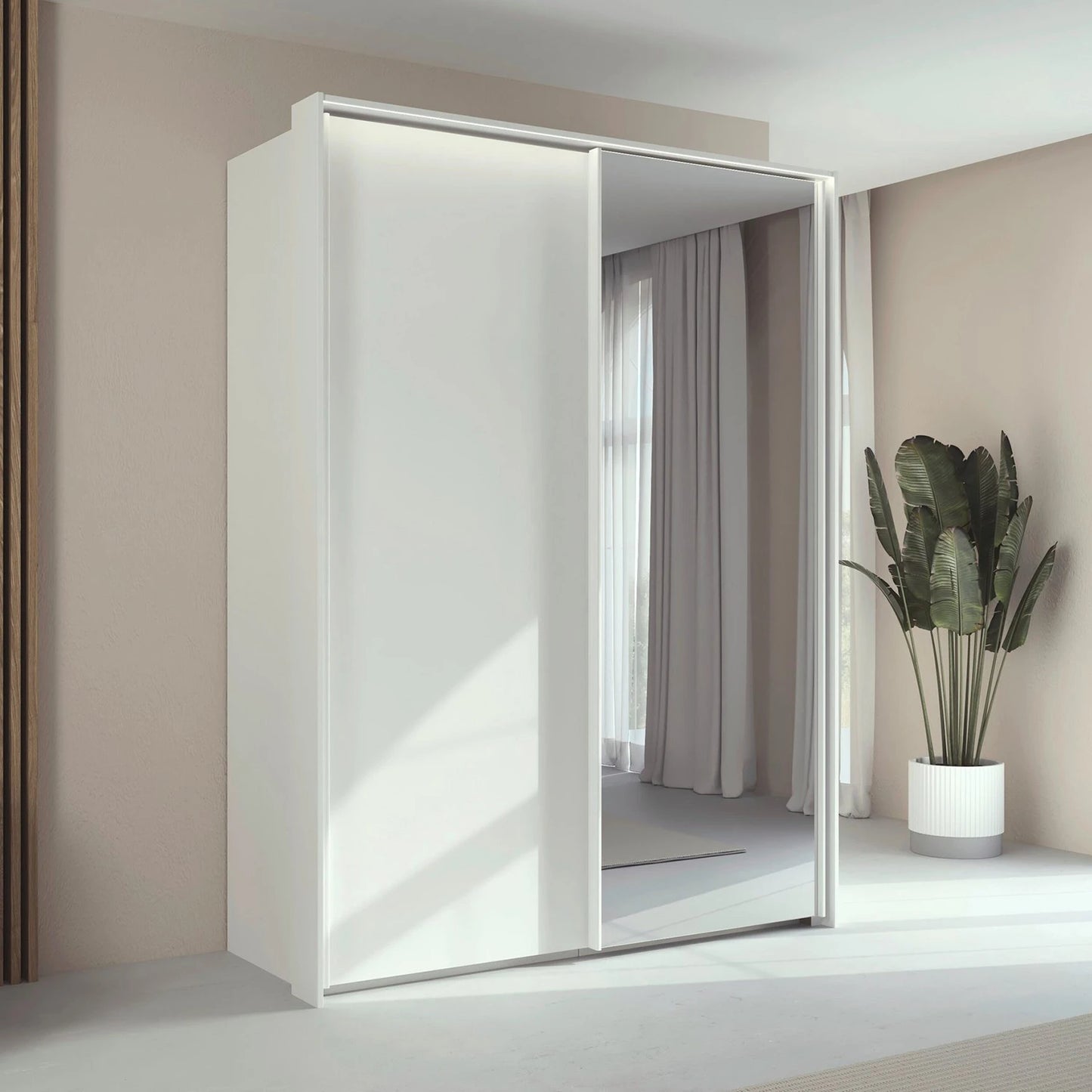 Rauch Taro 2 Door 1 Mirror Door Sliding Wardrobe in Alpine White finish with passepartout light frame styled in a modern bedroom