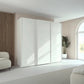 Rauch Taro 3 Door Sliding Wardrobe in Alpine White finish styled in a modern bedroom