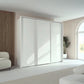 Rauch Taro 3 Door Sliding Wardrobe in Alpine White Styled in a modern bedroom